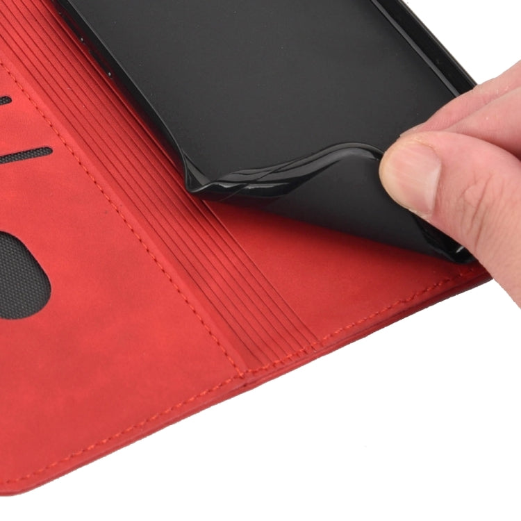 Red splicing leather phone case for Samsung Galaxy A05s, featuring a wallet design with card slot and stand functionality.